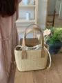 Summer straw bucket bag with leather handles and drawstring lining for beach vacation style. - Apricot