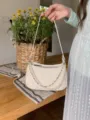 White quilted baguette bag with pearl and metal chain, elegant underarm shoulder bag. - Off White