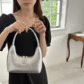 Silver metallic hobo underarm bag detail, stylish crescent shape with double handle zip. - Silver