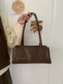 Brown retro leather underarm baguette bag detail view, casual commuting daily style. - Coffee Brown
