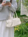 Korean style minimalist white shoulder baguette bag for women, versatile PU leather underarm bag. - White