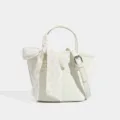 White quilted bucket bag for women, stylish crossbody handbag with floral scarf, ideal casual wear. - Ivory