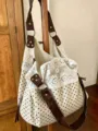 Detailed shot of the polka dot and white lace spliced hobo shoulder bag with brown straps. - Beige Polka Dot