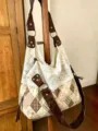 Detailed view of the Korean floral canvas patchwork hobo shoulder bag with elegant lace trim. - Grid Floral