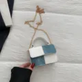 Mini denim and white leather patchwork crossbody bag with chic gold chain and top handle. - White and Blue