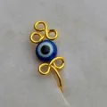 Dettaglio dell'anello da naso con perla blu malocchio e filo dorato per gioielli da piercing. - Stile 1 Oro Rosa / Stile 1