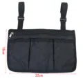 Wheelchair side storage bag detail view, black quilted fabric 32x18cm hanging pocket. - Wheelchair Armrest Storage Bag / Black