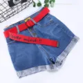 Blue denim shorts featuring a red canvas belt with letter print and metal double ring buckle. - Red