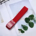 Red canvas belt for men and women, casual woven fabric with metal buckle, stylish daily wear. - Red