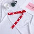 Red canvas belt with white daisy embroidery and double ring buckle for stylish outfits. - 120cm / Red