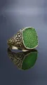 Close-up detail of retro men signet ring with green stones and vintage engraved patterns. - Size 6 / Green