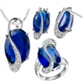 Elegante set di gioielli in pietra blu con collana orecchini e anello da donna. - Taglia 6 / Blu
