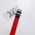 Red braided canvas belt for men featuring black leather trim and silver metal buckle style - 100cm / Square Buckle Red