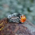 Close-up detail of vintage Thai silver amber flower ring texture and rustic background. - Size 6 / As Shown