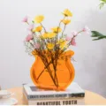 Acrylic decorative flower vase with artificial daisy bouquet for modern home tabletop styling. - Orange 5CM