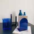 Minimalist blue acrylic bookend and desktop organizer, modern aesthetic book rack for home decor. - Blue