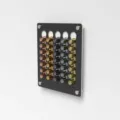 Wall-mounted acrylic coffee capsule organizer for home and office espresso pod storage rack display. - White Base Black Panel