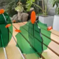 Detail view of the green and orange acrylic cactus ornament, creative desk decor and photography prop. - Spiny Cactus / 7x7cm