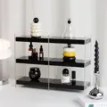 Detalle de estante de almacenamiento de escritorio de acrílico, organizador transparente cosméticos. - Doble fila / Negro