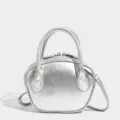 Stylish silver bowling bag for women, versatile shell tote and crossbody bag with top handles. - Silver