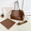 Brown large capacity shoulder tote bag detail view with pouch and wide strap for daily commute. - With Strap / Coffee