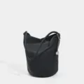 Borsa a secchiello nera in pelle morbida, elegante borsa a spalla con catena chic. - Nero