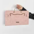 Detailed view of the pink cat ear laptop sleeve with beaded handle and metal clasp. - 15.6 Inch / Sakura Pink