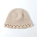 Close-up detail of beige crochet knitted bucket hat featuring hollow lace brim design. - Adjustable / Beige