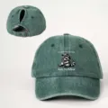 Distressed green ponytail baseball cap detail, featuring a cute raccoon graphic and adjustable strap. - Adjustable / Dark Green
