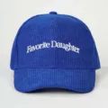 Blue corduroy baseball hat featuring white embroidered text detail, stylish casual outdoor cap. - Adjustable / Sapphire Blue