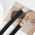 Stylish black woven elastic canvas belt featuring faux leather trim and metal pin buckle. - 100cm / Black