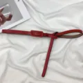 Minimalist red leather thin belt for women, genuine cowhide dress accessory, elegant strap. - Red
