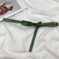 Green thin leather belt for women, minimalist dress accessory with stylish knot design. - Green