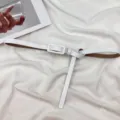 Women minimalist white thin leather belt variant, sleek versatile dress waist accessory style. - White
