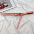 Pink minimalist thin leather belt for women, elegant dress waist accessory variant style. - Lotus Pink