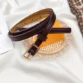 Minimalist thin leather belt for women, dark brown waist accessory with sleek gold square buckle. - Coffee