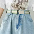 Women's green and white striped canvas belt with metal buckle worn with casual denim outfit - Light Green/Apricot/Dark Green