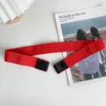 Red elastic lazy belt for women, buckle-free invisible design, adjustable jeans waist strap. - Red