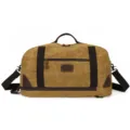 Grote vintage canvas reistas in khaki, stevige schoudertas voor reizen en sport gebruik. - Aardgeel