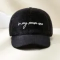 Close-up of black fleece and corduroy baseball cap with embroidered mom slogan design. - Adjustable / Black