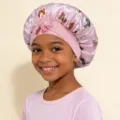 Kids satin sleep cap with cute butterfly print and front bow tie for hair care comfort. - Pink