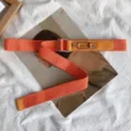 Orange canvas belt for women and men, stylish adjustable metal buckle denim waist belt. - Orange