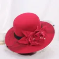 Red wool felt cloche hat detail, featuring elegant black mesh veil and large decorative floral accent. - M (56-58cm) / Peony Wine Red