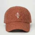 Detailed view of brown sherpa baseball cap with white embroidered rose and love text. - Adjustable / Coffee
