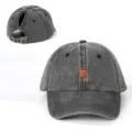 Detailed view of the washed black ponytail baseball cap, featuring a cocktail print and strap. - Adjustable / Black