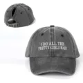 Close-up detail of the vintage washed grey ponytail baseball cap with front embroidery. - Adjustable / Black