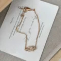 Elegante S925 sterling zilveren hoefijzer armband met sprankelende kristallen stenen. - XB174-Armband / Goud