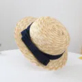 Detail shot of summer straw flat top hat with dark blue denim bow, cute sun protection beach hat. - 50-52cm (Recommended 2-6 Years) / Navy Blue