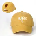 Detail shot of yellow distressed ponytail baseball cap featuring nurse life print and back strap. - Adjustable / Yellow