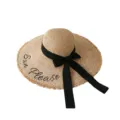 Woven raffia straw sun hat with black ribbon bow and chic fringe wide brim for summer beach travel. - Embroidered Letter Straw Hat